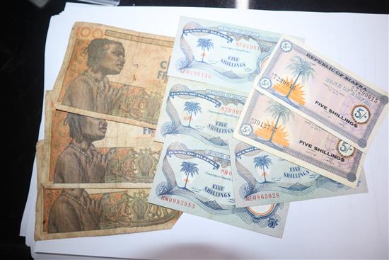 A collection of African and Egyptian currency, including Bank of Biafra banknotes,